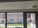 Scenic exterior view from a screened-in porch of a multi-Gathering complex with mature trees at 1181 Paseo Del Mar # D, Casselberry, FL 32707