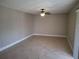 Bright living room with neutral walls, a ceiling fan, ceramic tile flooring, and natural light at 1181 Paseo Del Mar # D, Casselberry, FL 32707