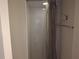 Clean white shower stall with shower curtain, towel rack, and convenient hooks at 1181 Paseo Del Mar # D, Casselberry, FL 32707