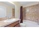 This bathroom has a shower-tub combo and vanity at 4032 Mountain Chestnut Way, Lakeland, FL 33812