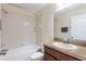 This bathroom has a shower-tub combo and vanity at 4032 Mountain Chestnut Way, Lakeland, FL 33812