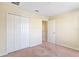 This bedroom has neutral walls, carpet, and lots of closet space at 4032 Mountain Chestnut Way, Lakeland, FL 33812