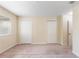 This bedroom has neutral walls, carpet, and a window at 4032 Mountain Chestnut Way, Lakeland, FL 33812