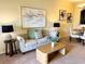 Comfortable living room featuring stylish furniture, decor, and dining area with natural light at 4032 Mountain Chestnut Way, Lakeland, FL 33812