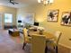 Cozy living room and dining area with neutral tones, offering a relaxed atmosphere at 4032 Mountain Chestnut Way, Lakeland, FL 33812