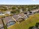 Aerial view of community, highlighting numerous homes with pools at 313 Kensington Dr, Davenport, FL 33897