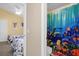 Bathroom with shower, featuring a colorful ocean-themed shower curtain at 313 Kensington Dr, Davenport, FL 33897
