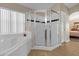 Bathroom with corner shower and separate tub at 313 Kensington Dr, Davenport, FL 33897