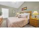 Spacious bedroom with king-size bed and ensuite bathroom at 313 Kensington Dr, Davenport, FL 33897