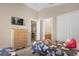 Charming bedroom with twin beds, dresser, and an ensuite bathroom at 313 Kensington Dr, Davenport, FL 33897
