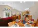 Casual dining area with a wood table, set for a meal, overlooking the living room at 313 Kensington Dr, Davenport, FL 33897