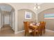 Dining area with hardwood table and chairs, and access to other rooms at 313 Kensington Dr, Davenport, FL 33897