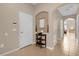 Bright entryway with tile flooring, a small table, and access to other rooms at 313 Kensington Dr, Davenport, FL 33897