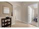 Clean entryway with tile floors, mirror, and doors to other rooms of the house at 313 Kensington Dr, Davenport, FL 33897