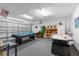 Fun game room with pool table, air hockey, and seating at 313 Kensington Dr, Davenport, FL 33897