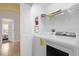 Convenient laundry room with washer, dryer, and extra shelving at 313 Kensington Dr, Davenport, FL 33897