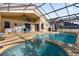 Inviting screened pool and spa with patio furniture at 313 Kensington Dr, Davenport, FL 33897