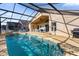 Refreshing pool with screened enclosure and outdoor kitchen at 313 Kensington Dr, Davenport, FL 33897