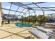 Inviting pool and spa with plenty of lounge chairs at 313 Kensington Dr, Davenport, FL 33897
