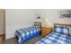 Comfortable bedroom with twin beds, wood furnishings, and light filled space at 475 Windsor Pl, Davenport, FL 33896