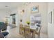 Dining area with large windows providing pool views at 475 Windsor Pl, Davenport, FL 33896
