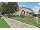 Charming home exterior with landscaped front yard, red shutters, and brick walkway at 475 Windsor Pl, Davenport, FL 33896