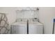 Practical laundry room with appliances and ample storage for convenience at 475 Windsor Pl, Davenport, FL 33896