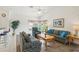 Bright living room with vaulted ceilings, hardwood floors, and ample natural light at 475 Windsor Pl, Davenport, FL 33896