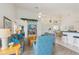 Open-concept living room with vaulted ceilings and lots of natural light at 475 Windsor Pl, Davenport, FL 33896
