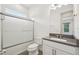 Bathroom with a modern vanity, sleek fixtures, and a glass-enclosed shower/tub combination at 2132 Antilles Club Dr, Kissimmee, FL 34747