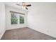 A bright and airy bedroom features large windows, neutral paint, and plush carpeting at 2132 Antilles Club Dr, Kissimmee, FL 34747
