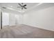 A bright and airy bedroom featuring plush carpeting, recessed lighting, and a ceiling fan for added comfort at 2132 Antilles Club Dr, Kissimmee, FL 34747