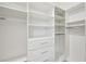 Custom walk-in closet with built-in shelving and drawers, providing ample storage and organization solutions at 2132 Antilles Club Dr, Kissimmee, FL 34747