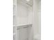Organized walk-in closet featuring custom shelving and ample storage space for clothing at 2132 Antilles Club Dr, Kissimmee, FL 34747