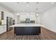 Spacious kitchen featuring a large island, stainless steel appliances, and modern white cabinetry at 2132 Antilles Club Dr, Kissimmee, FL 34747