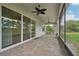 Covered patio with brick flooring and an outdoor kitchen featuring a stainless steel grill at 2132 Antilles Club Dr, Kissimmee, FL 34747