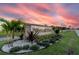 Elegant entrance sign for Indian Lake Estates with lush landscaping and a scenic sunset backdrop at 3911 Gardenia Dr, Indian Lake Estates, FL 33855