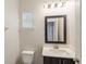 Simple bathroom with vanity and toilet at 233 Macaulay S Cv, Haines City, FL 33844