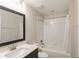 Clean bathroom with bathtub, shower, and vanity at 233 Macaulay S Cv, Haines City, FL 33844