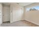 Spacious bedroom with ample closet space and a window at 233 Macaulay S Cv, Haines City, FL 33844