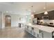 Open concept kitchen with island and white countertops at 233 Macaulay S Cv, Haines City, FL 33844