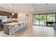 Modern kitchen with stainless steel appliances and an island at 233 Macaulay S Cv, Haines City, FL 33844