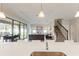 Open kitchen with view into living room and backyard at 233 Macaulay S Cv, Haines City, FL 33844