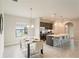 Modern kitchen features stainless steel appliances and an island with seating at 233 Macaulay S Cv, Haines City, FL 33844