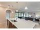 Open concept kitchen with island and access to backyard at 233 Macaulay S Cv, Haines City, FL 33844