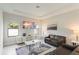 Spacious living room with large TV and comfortable seating at 233 Macaulay S Cv, Haines City, FL 33844