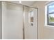 Clean shower with glass enclosure and window at 233 Macaulay S Cv, Haines City, FL 33844
