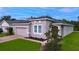 Single-story house with a two-car garage and well-manicured lawn at 3225 Stratton Cir, Kissimmee, FL 34744