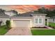 One story home with attached garage and landscaped front yard at 3225 Stratton Cir, Kissimmee, FL 34744
