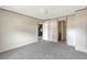 Bedroom with carpet, and doors to bathroom and kitchen at 9100 Sw 32Nd Ct, Ocala, FL 34476